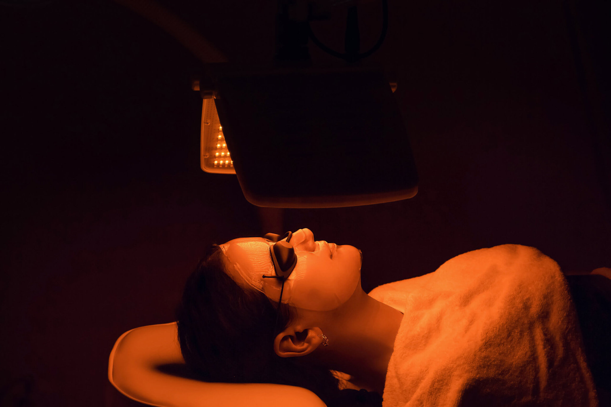 Young,Woman,Having,Yellow,Led,Light,Facial,Therapy,Treatment,In